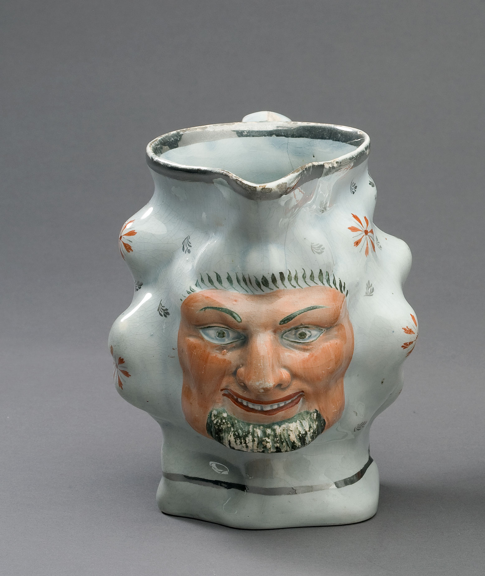 Appraisal: STAFFORDSHIRE SILVER LUSTRE AND ENAMEL-DECORATED SATYR JUG POSSIBLY THOMAS HARLEY