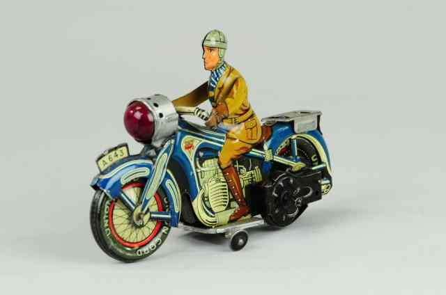 Appraisal: ARNOLD MOTORCYCLE WITH RIDER Germany lithographed tin clockwork motorcycle done