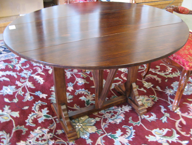 Appraisal: DROP-LEAF LUNCHEON TABLE antique reproduction recent The pine table has