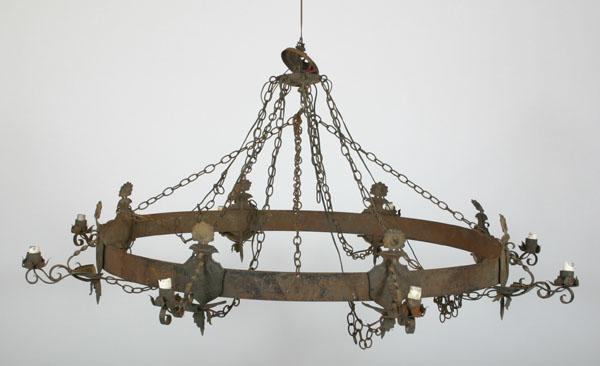 Appraisal: Large cast metal circular -light chandelier twisted metal and silhouette