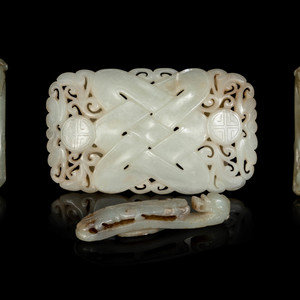 Appraisal: Four Chinese Jade Belt Ornaments comprising three celadon jade chilong