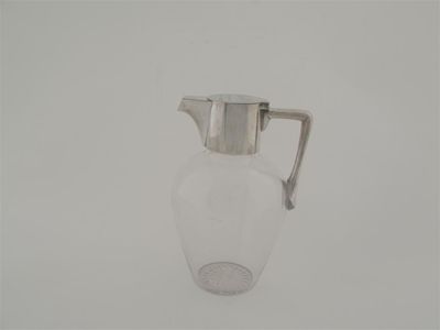 Appraisal: A late Victorian mounted glass claret jug with an inscription