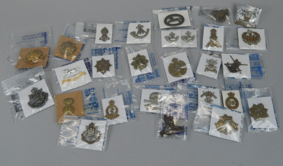 Appraisal: Various military cap badges to include The Northamptonshire Yeomanry the