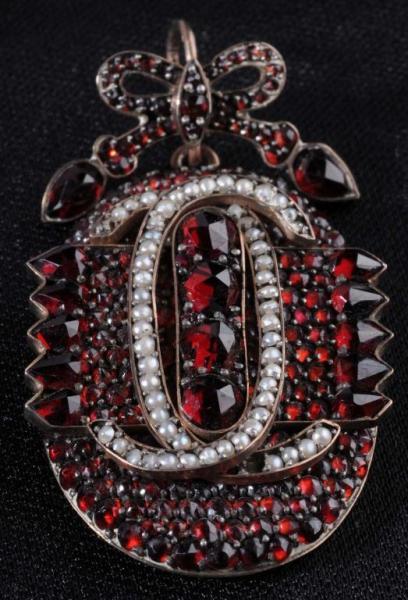 Appraisal: Garnet Locket Pendant Description Exquisite Incased in its own special