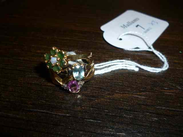 Appraisal: AN EMERALD AND OPAL CT GOLD CLUSTER RING together with