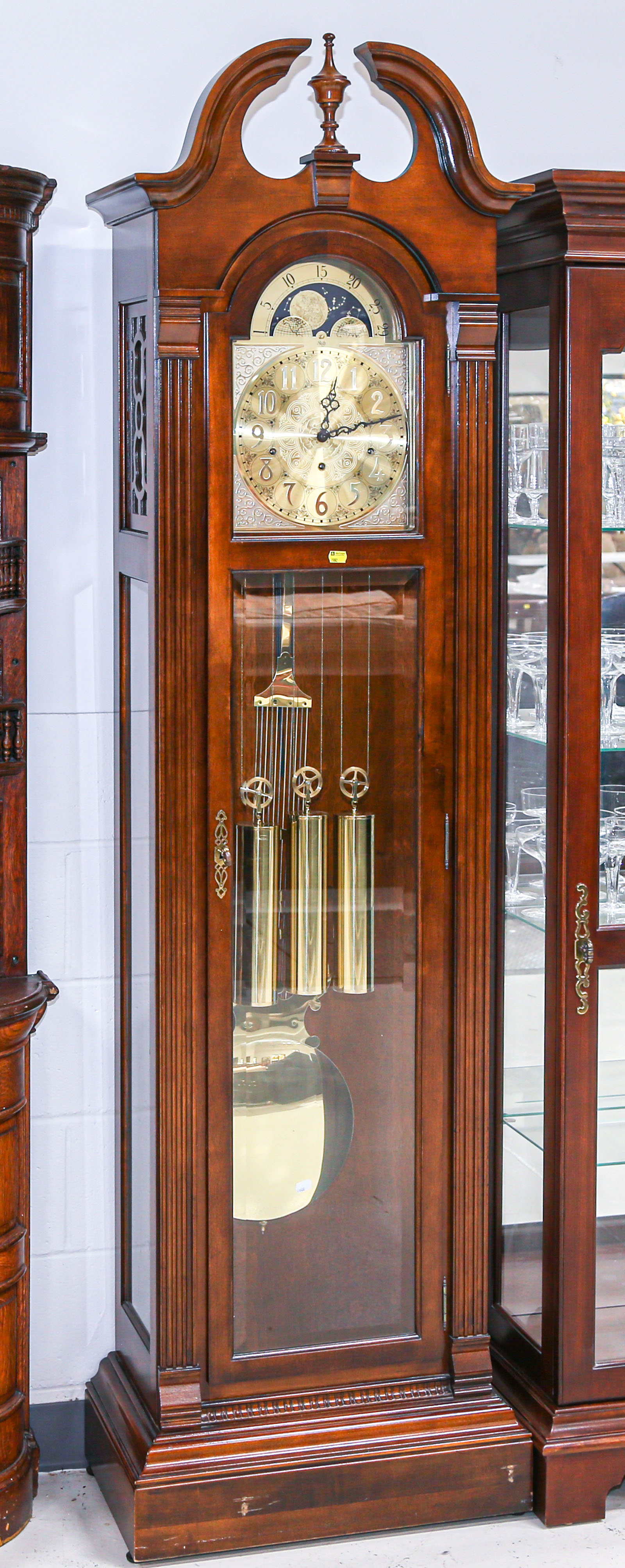 Appraisal: SLIGH GRANDFATHER CLOCK Modern in a cherry case with glass