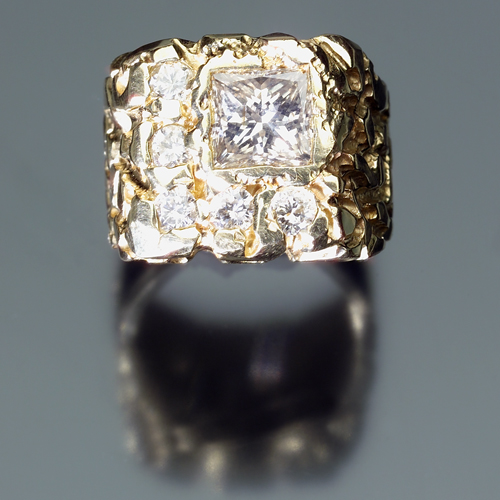 Appraisal: Substantial diamond gentleman's ring in k yellow gold Nugget mount