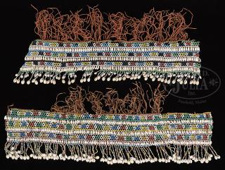 Appraisal: TWO AFRICAN COWRY SHELL AND BEAD WORK LADIES DANCE ORNAMENTS