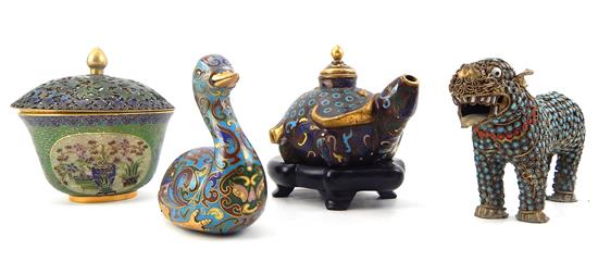 Appraisal: ASIAN Four decorative arts including animal figurines standing foo lion