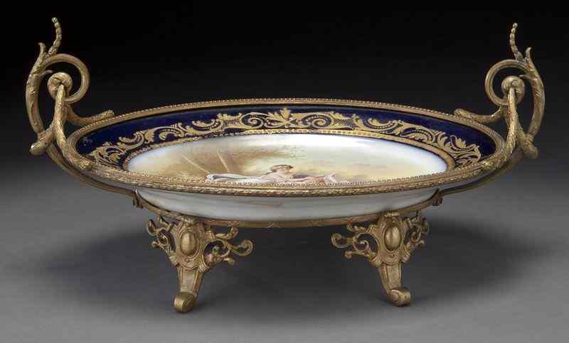 Appraisal: Sevres style ormolu mounted porcelain centerpiece painted with a classical