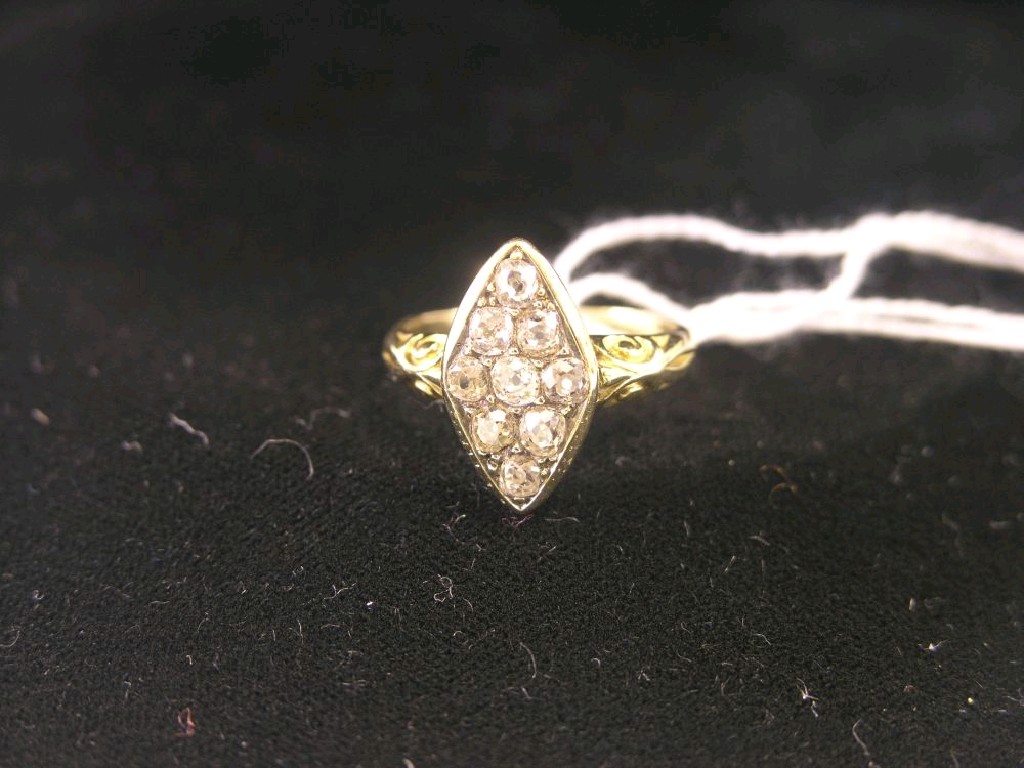 Appraisal: A yellow metal and diamond ring nine small diamonds arranged