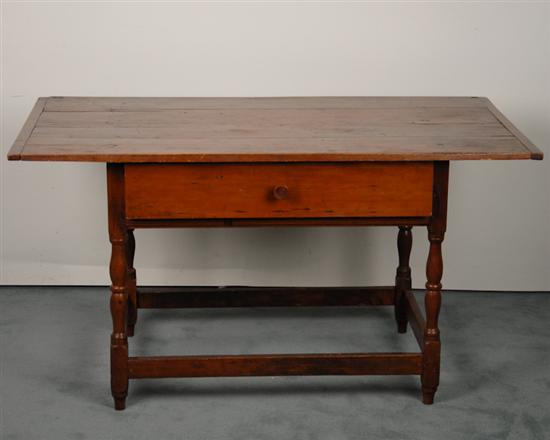 Appraisal: An th C New England Cherry Tavern Table having breadboard