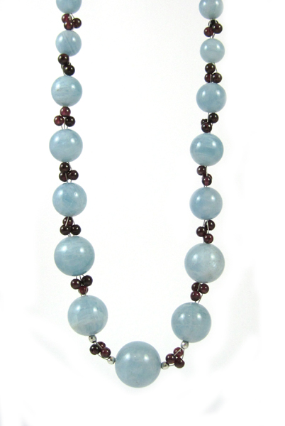 Appraisal: AQUAMARINE GARNET AND WHITE GOLD NECKLACE measuring - inches in