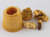 Appraisal: Five ivory items being a netsuke of a man with