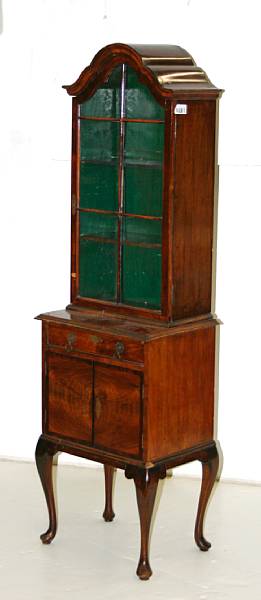 Appraisal: A Queen Anne style walnut side cabinet