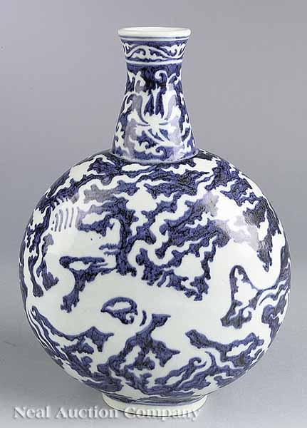 Appraisal: A Chinese Blue and White Reserve-Decorated Porcelain Moon Flask the