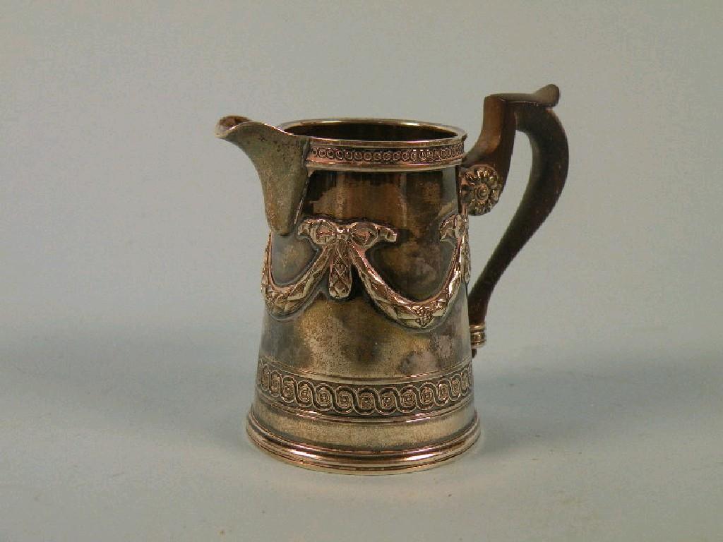 Appraisal: A Continental white metal small milk jug decorated with swags