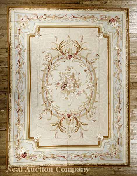 Appraisal: An Aubusson-Style Needlepoint Carpet cream and blue ground border and