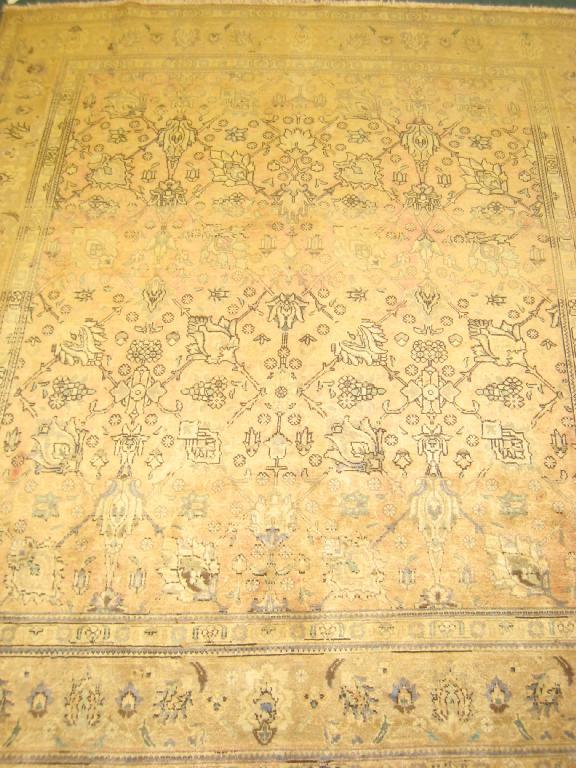 Appraisal: A bordered Tabriz Carpet with palmette and leafage design on