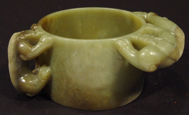 Appraisal: Oriental green jade bowl carved with animal design handles cm