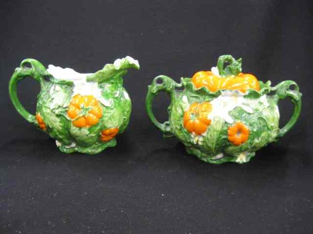 Appraisal: Austria Porcelain Figural Creamer Sugar tomato flowering vine design ''