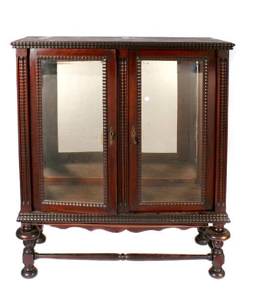 Appraisal: A Portugese rosewood display cabinet losses height in width in