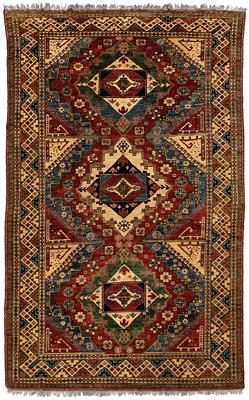 Appraisal: Caucasian design rug three central medallions ivory green and blue