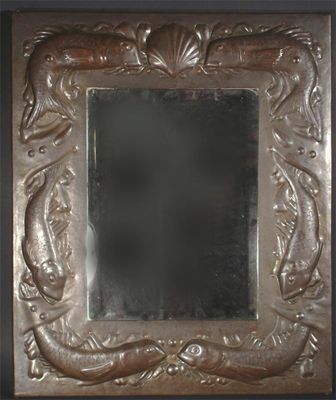 Appraisal: A Newlyn patinated copper mirror hammered in relief with a