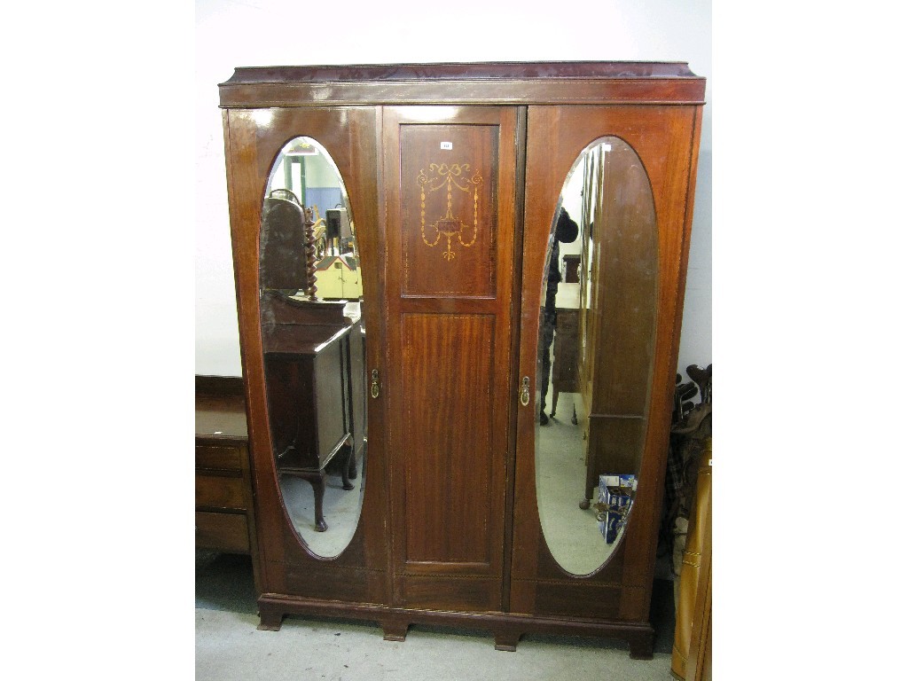 Appraisal: Edwardian mahogany triple wardrobe with matching chest and dressing table