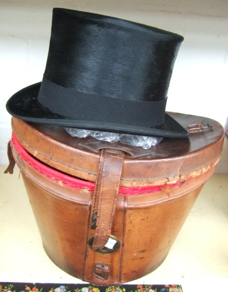 Appraisal: A Victorian silk hat in a leather fitted box by