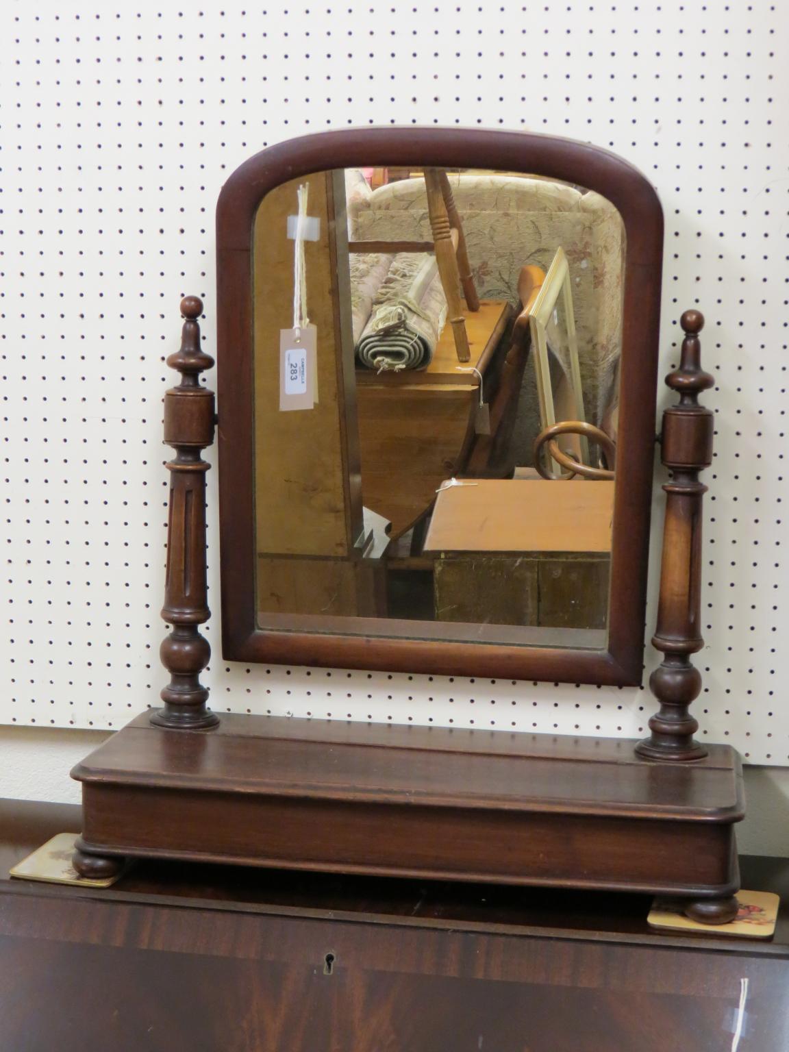 Appraisal: A Victorian mahogany toilet mirror domed mirror plate adjustable on