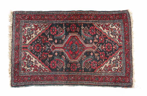 Appraisal: A group of three rugs comprising two Iranian rugs and