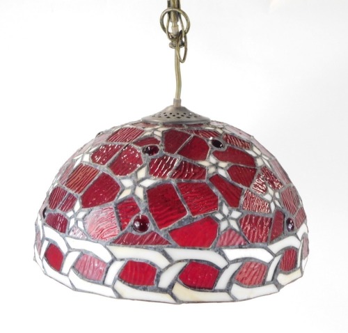 Appraisal: A Tiffany style light shade on red paneled ground with