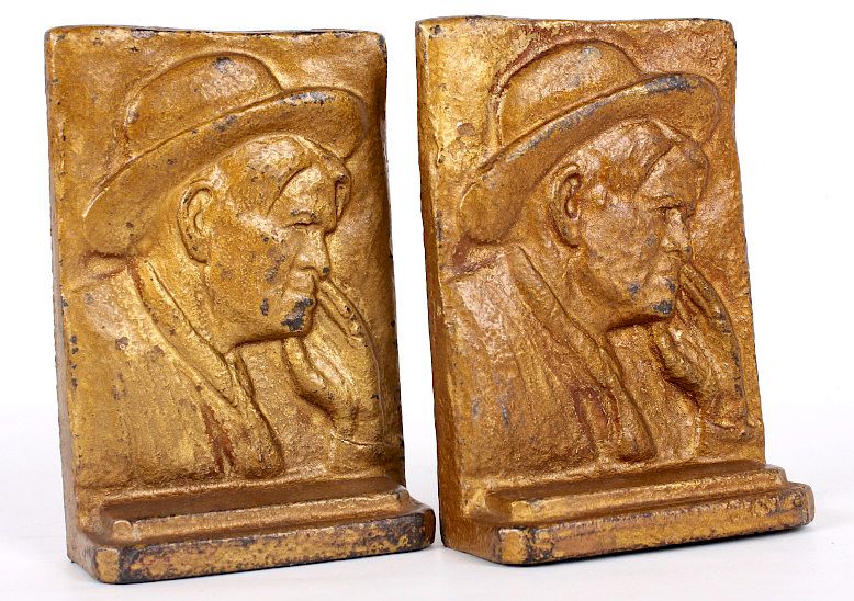 Appraisal: Vintage Charlie Russell Cast Iron Bookends This lot features a