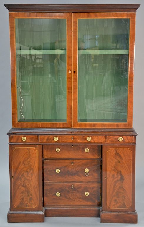 Appraisal: George III mahogany two part cabinet with cloth lined top