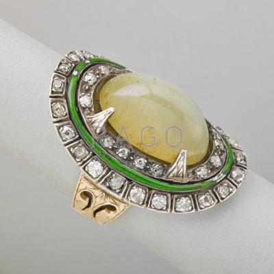 Appraisal: CAT S EYE CHRYSOBERYL DIAMOND RING Oval sugar loaf cat