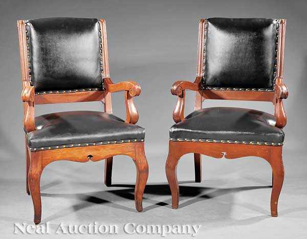 Appraisal: A Pair of Directoire-Style Carved Fruitwood Fauteuils padded back scrolled