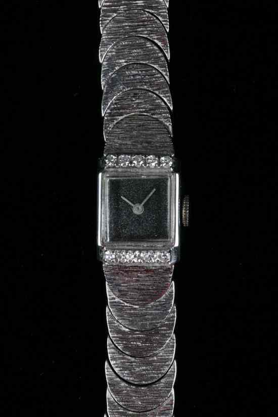 Appraisal: LADY'S K WHITE GOLD AND DIAMOND WRISTWATCH Square case edged