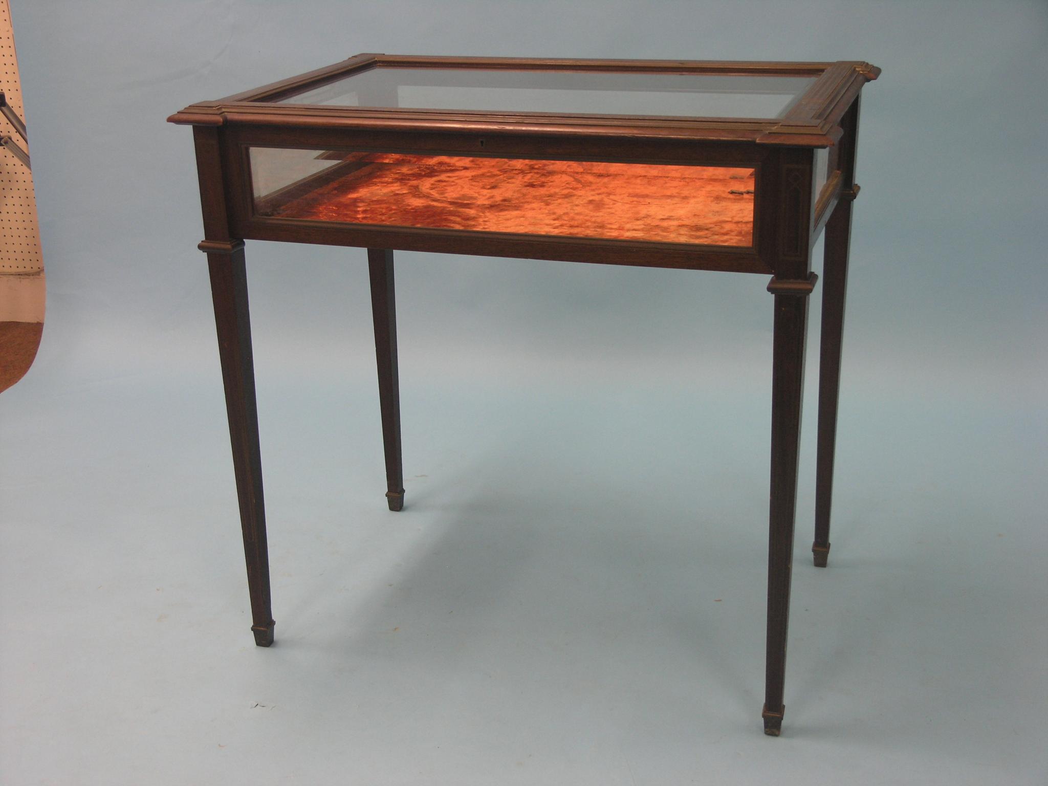 Appraisal: A late Victorian mahogany and brass-inlaid bijouterie rectangular-shape with bevelled