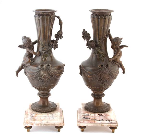 Appraisal: A pair of French patinated metal and marble urns each