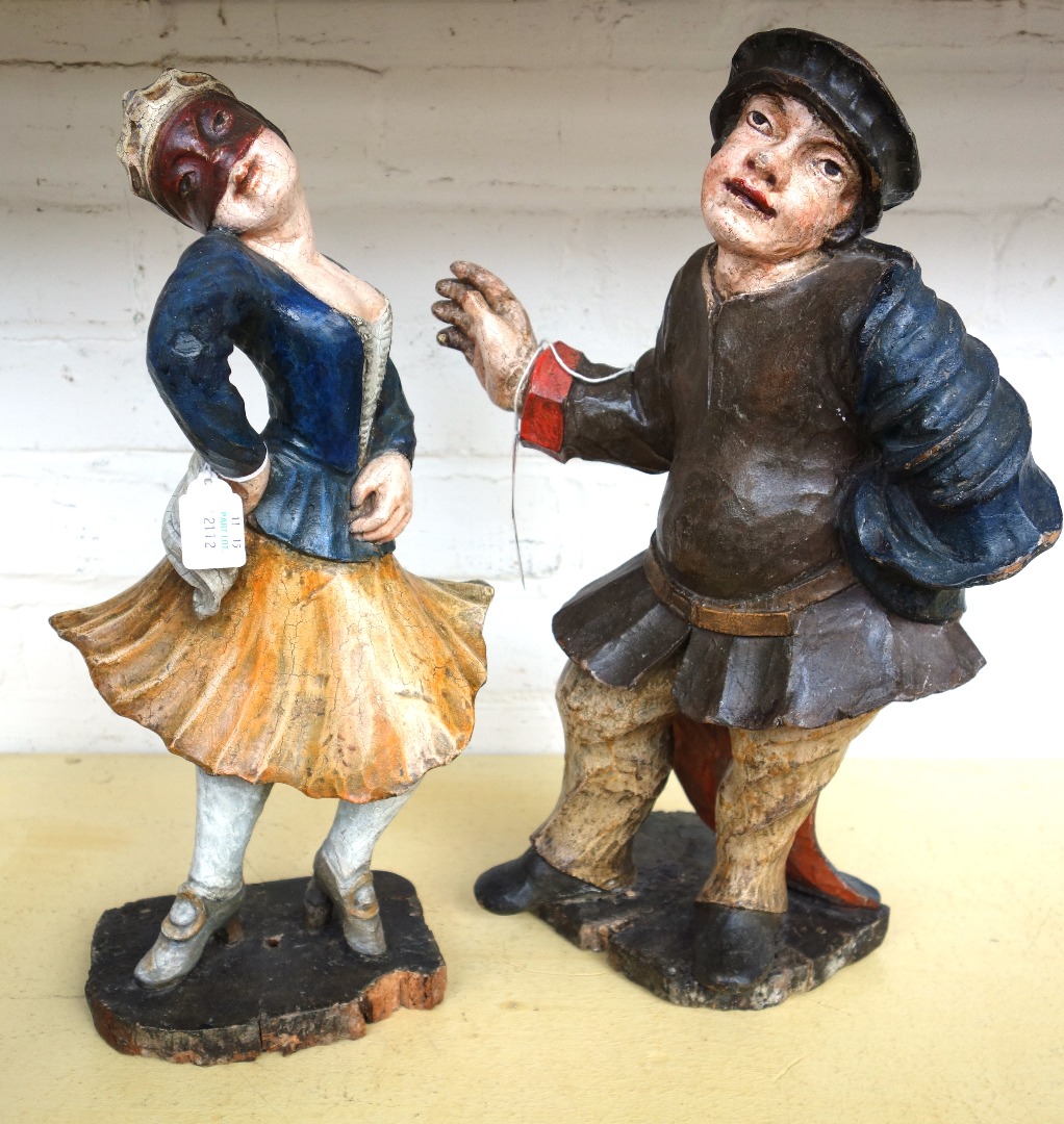 Appraisal: Two polychrome painted pine figures from the Commedia dell'arte th