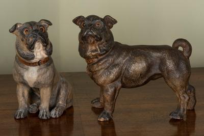 Appraisal: Two painted pottery figures of pugs each with glass eyes