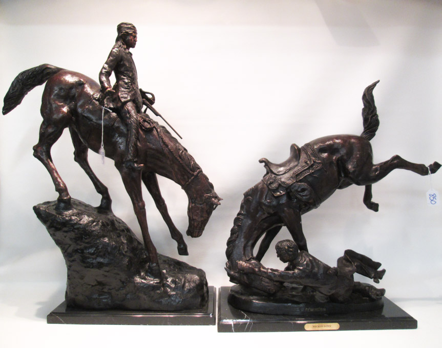 Appraisal: TWO PATINATED BRONZE SCULPTURES depicting figures on horseback Each after