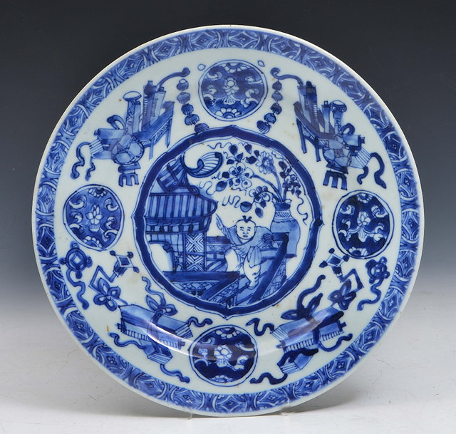 Appraisal: A CHINESE BLUE AND WHITE PLATE decorated with a youth