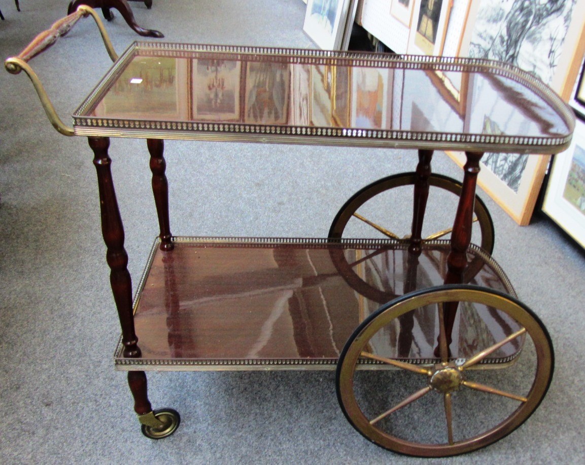 Appraisal: A th century brass mounted two tier serving trolley with