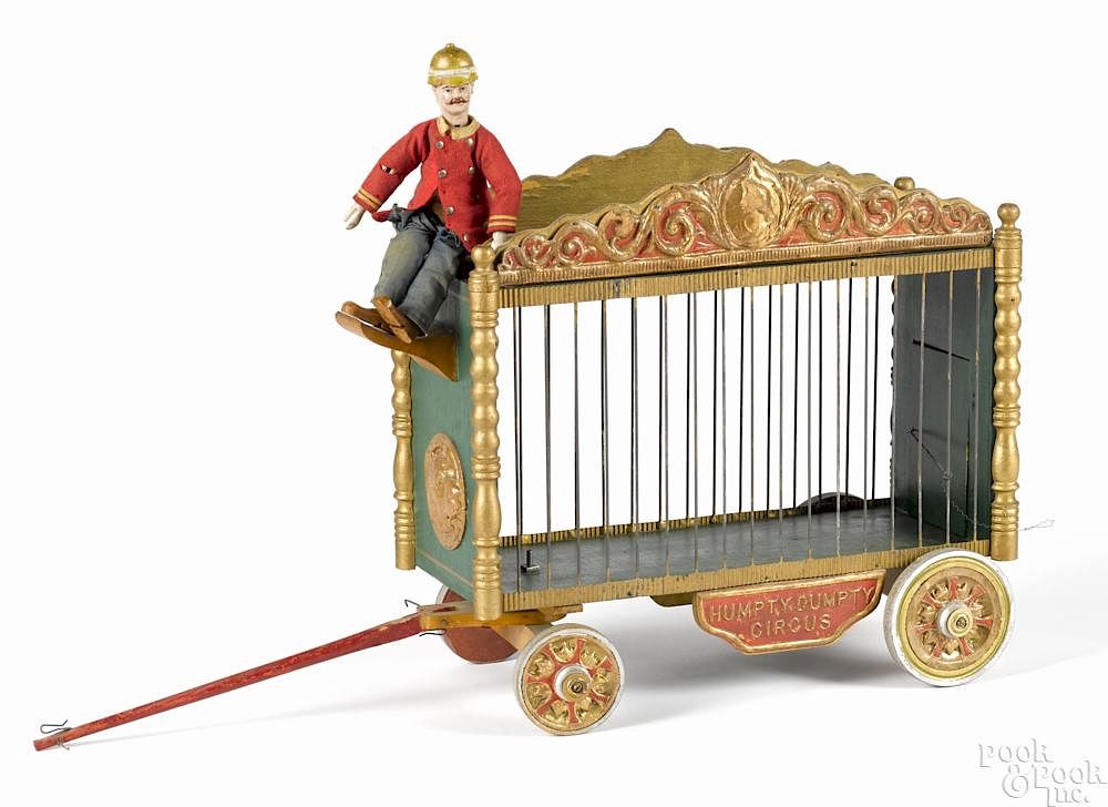 Appraisal: Schoenhut Humpty Dumpty circus cage wagon with a driver ''