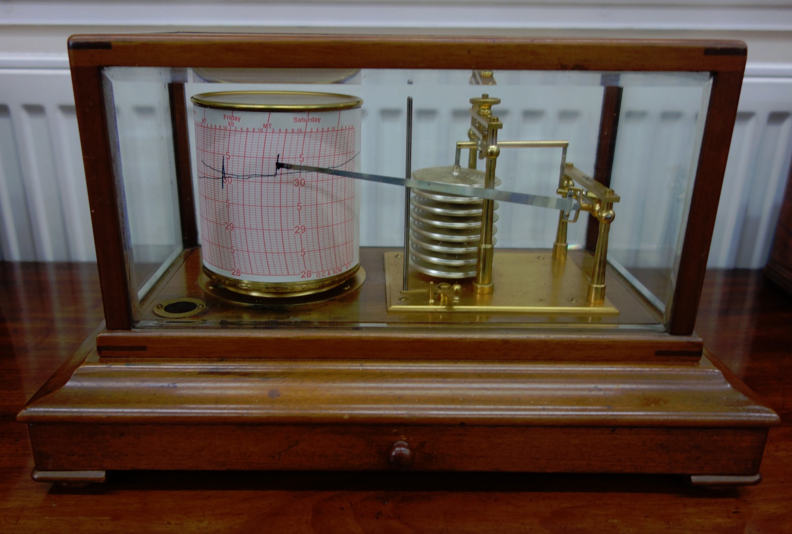 Appraisal: A mahogany cased barograph by Sandmc with eight tier vacumn