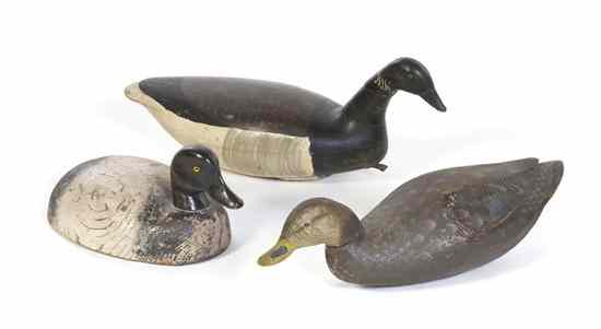 Appraisal: Three American Carved Wood and Polychrome Painted Duck Decoys comprising