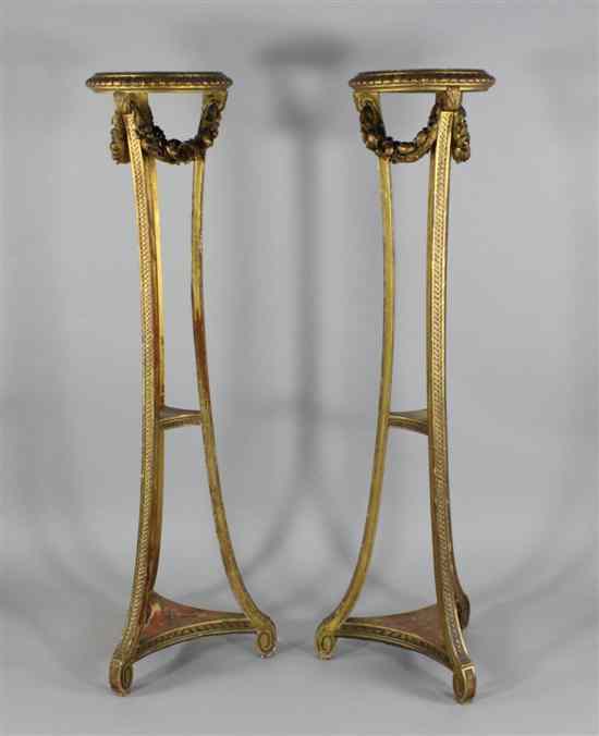 Appraisal: A pair of mid th century giltwood and gesso torcheres