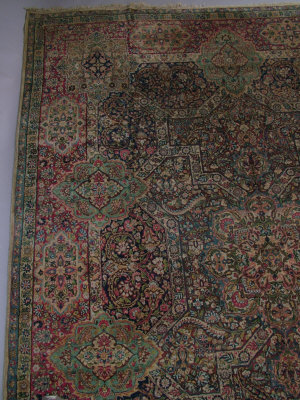 Appraisal: A Tabriz carpet with pole medallion and other medallions strapwork